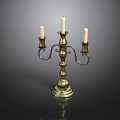 Brass Candelabra With Three Candles And Ornate Design On Black Background
