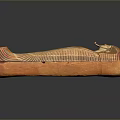 Ancient Egyptian Sarcophagus Sculpture Carving With Orange Stone Face And Wing Patterns