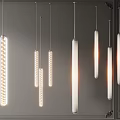Modern Interior Featuring Multiple Suspended Pendant Lights With Cylindrical Textured Designs And Warm Glow