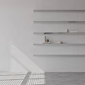 White Wall Featuring Floating Shelves With Minimalist Accessories Small Jars Bowls Striped Shadows