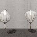 White Lantern Shaped Chandeliers With Striped Design And Tassels Against Gray Wall Interior