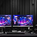 Modern Gaming Desk and Chair Set With Dual Monitors RGB PC Case City Night Backdrop