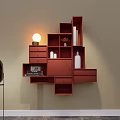 Red Modular Wall Cabinets with Compartments Drawers on Beige Wall Decorative Vases Books and Lamp