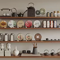 Traditional Tea Ware Display With Teapots Trays Cups And Caddies On Layered Shelves