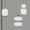 Japanese Style Layered Paper Lantern Chandeliers With White Shades And Black Frames Hanging On Wall
