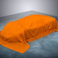 Orange Cloth Covered Object Placed On Gray Floor With Gray Background