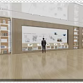 Modern Mall Store With Person Standing In Front Of Large Screen Bookshelves And Wooden Flooring