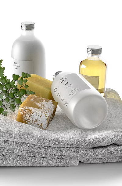 Essential Stylish Bathroom Accessories With Soft Towels Soap Liquid Bottles And Greenery 3d model