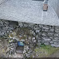 Traditional Stone Cottage Model With Slate Roof Blue Door Chimney And Greenery