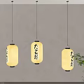 Japanese Style Pendant Lights Featuring Yellow Lampshades And Japanese Characters With Green Plant