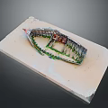 Detailed Model Boat Display On Light Colored Base With Green Plants And Red Structures