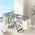 Green Foldable Clothes Drying Rack With Hanging Dresses And Shirts Indoor