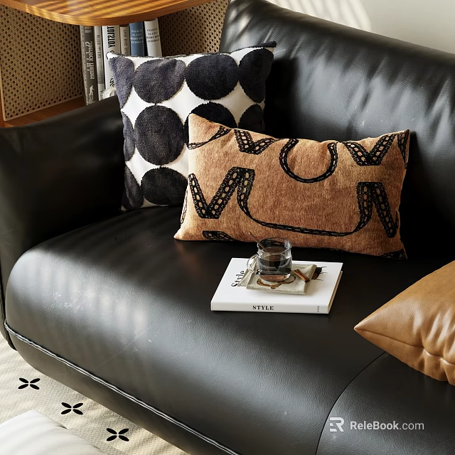 Stylish Throw Pillows on Black Leather Sofa with Brown Letter and Polka Dot Designs 3d model 