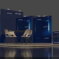 Blue Exhibition Booth With Display Panels Round Table White Chairs And Reception Desk
