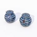 Set of Two Decorative Blue and White Ceramic Jars with Lids and Intricate Patterns