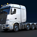 Modern Silver Tractor Unit With Tri Axle And Yellow Roof Lights