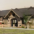 Traditional Detached Villa With Stone Exterior Arched Porch Black Roof And Green Courtyard