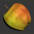 Red And Yellow Apple With Stem On Dark Reflective Surface