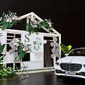 Commercial Wedding Decoration Equipment With White Floral Structure Green Plants And Service Car