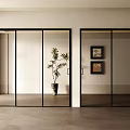 Modern Interior With Glass Sliding Doors Black Frames Decorative Paintings And Potted Plant