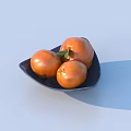 Three fresh persimmons on black plate with green leaf against light blue background