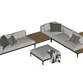 Modern Gray Sectional Sofa With Throw Pillows Knitted Blanket And Wooden Side Tables