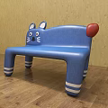 Cat Shaped Blue Public Bench With Ears Eyes Whiskers Red Tail And White Striped Legs