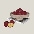 Fresh Red Plums in Stone Bowl on Books with Halved Fruit