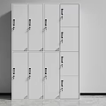 White Multiple Locker Storage Units With Lockable Doors Against Gray Wall And Floor