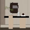 Modern Console Table with Green Plant Vase Books and Decor on Light Colored Wall