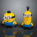 Two Cute Yellow Minions Toy Characters Wearing Blue Overalls And Goggles