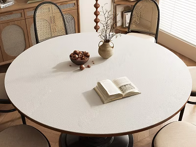 Round Table with Rattan Chairs Open Book Bowl of Nuts and Vase Near Wooden Cabinet 3d model