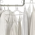 Minimalist White Clothes Hanging On Racks With Shirts Dresses And Storage Boxes