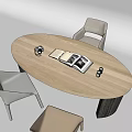 Wooden Oval Desk With Open Magazine Black Mug Gold Decorative Items And Gray Beige Chairs