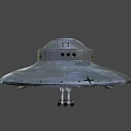 Silver Gray UFO Model With Circular Design Cross Symbol Landing Gear And Illuminated Parts