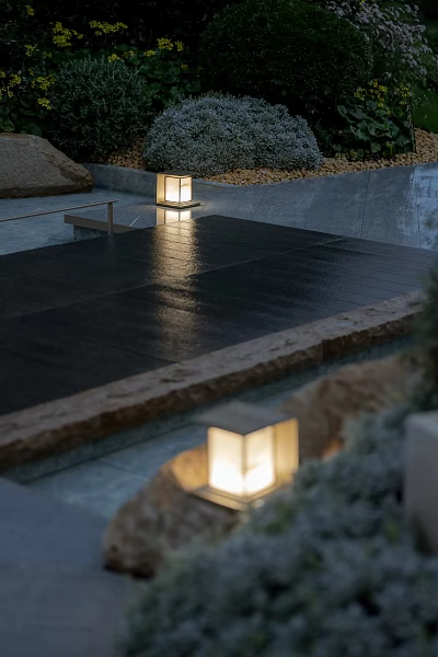 Outdoor Lantern Style Lights Illuminating Wet Stone Pavement In Evening Garden With Natural Surroundings 3d model