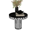 Modern Round Side Table With Black White Striped Base Vase Bowl And Books