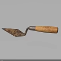 Rusty Trowel With Metal Blade And Wooden Handle On Dark Background With Reflection