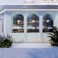 White Magic Box Dessert Shop Exterior With Arched Windows Front Steps And Green Plants