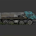 Teal Colored Dump Truck With Open Bed Metal Parts And Grass Surroundings