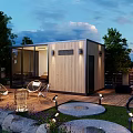 Modern Wooden Guesthouse Building With Glass Windows Outdoor Chairs Patio Lawn And Evening Lighting
