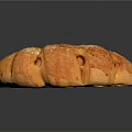 Freshly Baked Golden Curved Bread With Sesame Seeds And Shiny Crust