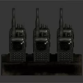 Multiple Black Walkie Talkies Charging On Desktop Dock Station For Communication