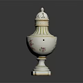 Ornate White Ceramic Urn With Floral Patterns Lid And Gold Trim Base