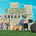 Xiamen Limited Camping Festival Scene With Musical Instruments Grass Field Wooden Backdrop And Colorful Decorations