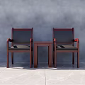 Two Mahogany Armchairs With Black Cushions And Small Wooden Table In Gray Room