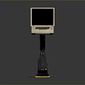 Vintage Portable Computer With Monitor Keyboard On Black Stand And Yellow Label