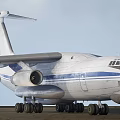 Large Military Transport Aircraft In Flight With Extended Landing Gear And Blue Stripes