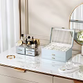 Light Blue Jewelry Box With Transparent Lid And Drawers For Gold Jewelry On Marble Countertop