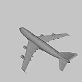 Dark Colored Airplane Flying With White Wings And Tail Logo In Sky
